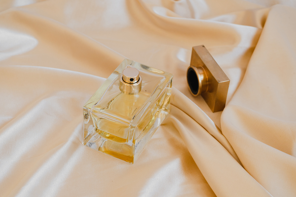Perfume Bottle on Beige Silk Fabric